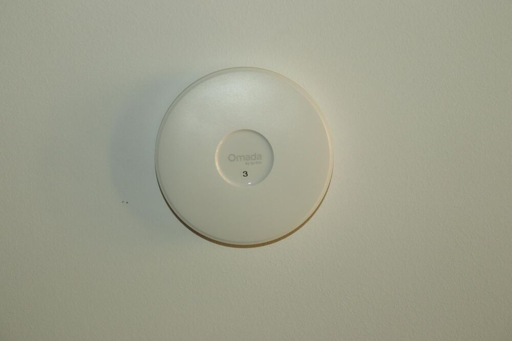 Installed Omada TP-Link wireless access point on wall